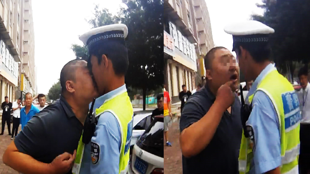 交警执法遇尴尬 被司机强行“贴脸”
