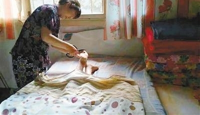 19年来 她用柔弱肩膀扛起一个家
