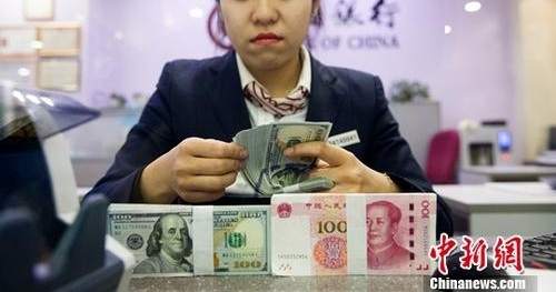 中国完善人民币跨境业务政策 出新规促贸易投资便利化